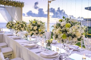 wedding venue near the ocean with white and yellow flowers