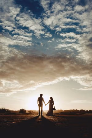 bride and groom at sunet